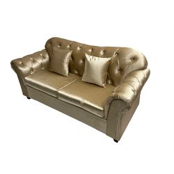 Chesterfield shaped two seat sofa, upholstered in buttoned champagne fabric, with scatter cushions