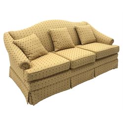 Plumbs Furniture - mahogany framed three seat sofa, shaped back and arms, upholstered in pale gold and patterned fabric, moulded square supports and stretchers