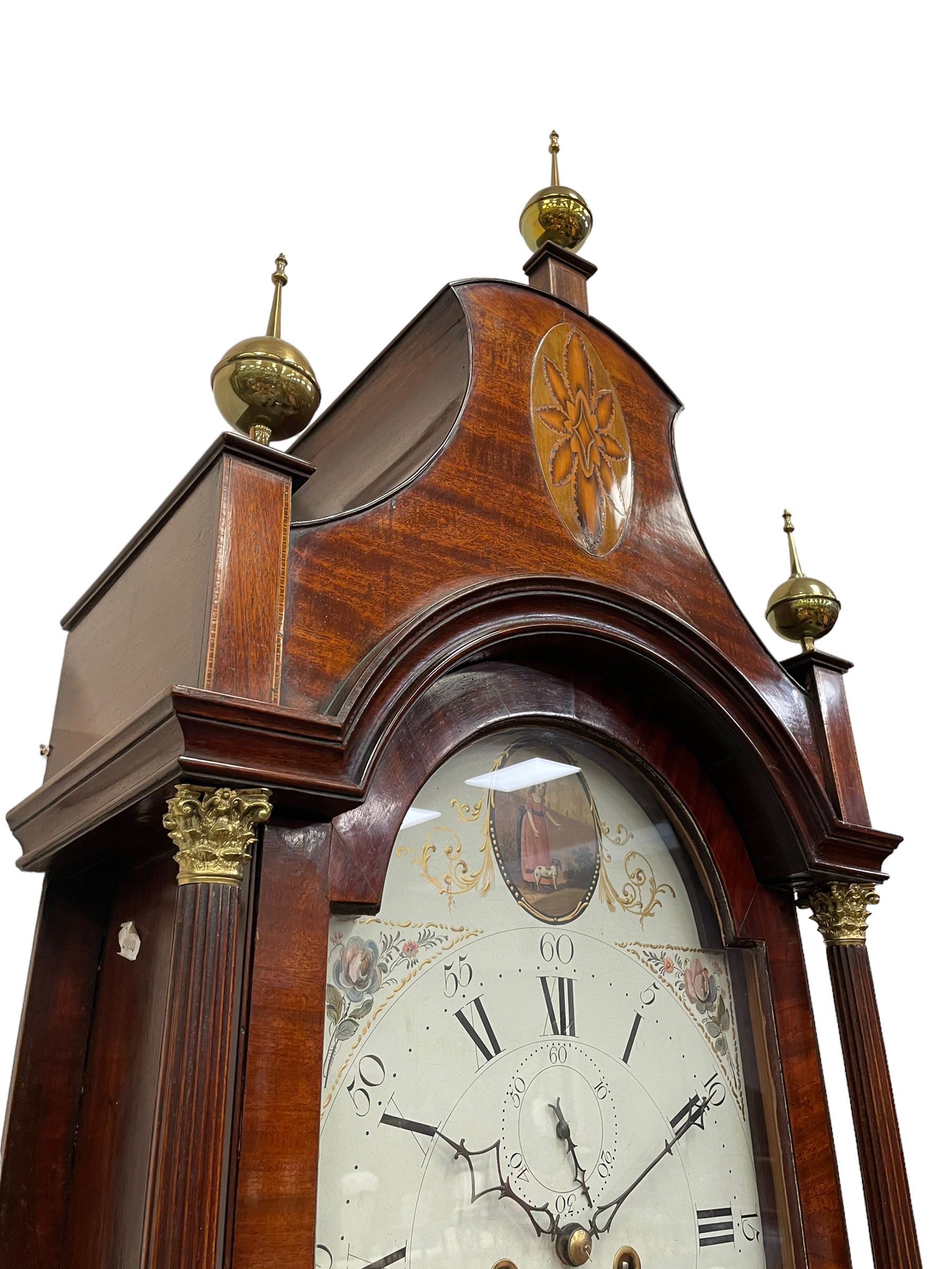 Denton & Fox of Hull – Early 19th century mahogany 8-day longcase clock c1802, pagoda pediment with an oval inlay and three ball and spire finials, break arch painted dial and hood door flanked by reeded pilasters with brass Corinthian capitals, long trunk door with conforming break arch top on a rectangular plinth raised on bracket feet, early Wilson (Birmingham) dial with Roman numerals, five minute Arabic’s and minute dots, subsidiary seconds dial and calendar aperture, with matching steel hands, floral spandrels within raised gesso work and a conforming oval depiction of a young maiden and dog to the break arch, dial pinned via a falseplate to a rack striking movement with a recoil anchor escapement striking the hours on a cast bell. With pendulum and weights.
Joseph Denton was a respected and prolific Hull clock maker working in Scale Lane Hull 1779 and Silver Street 1782-1814. Entering a short-lived partnership with Charles Fox from Beverley in 1802.
