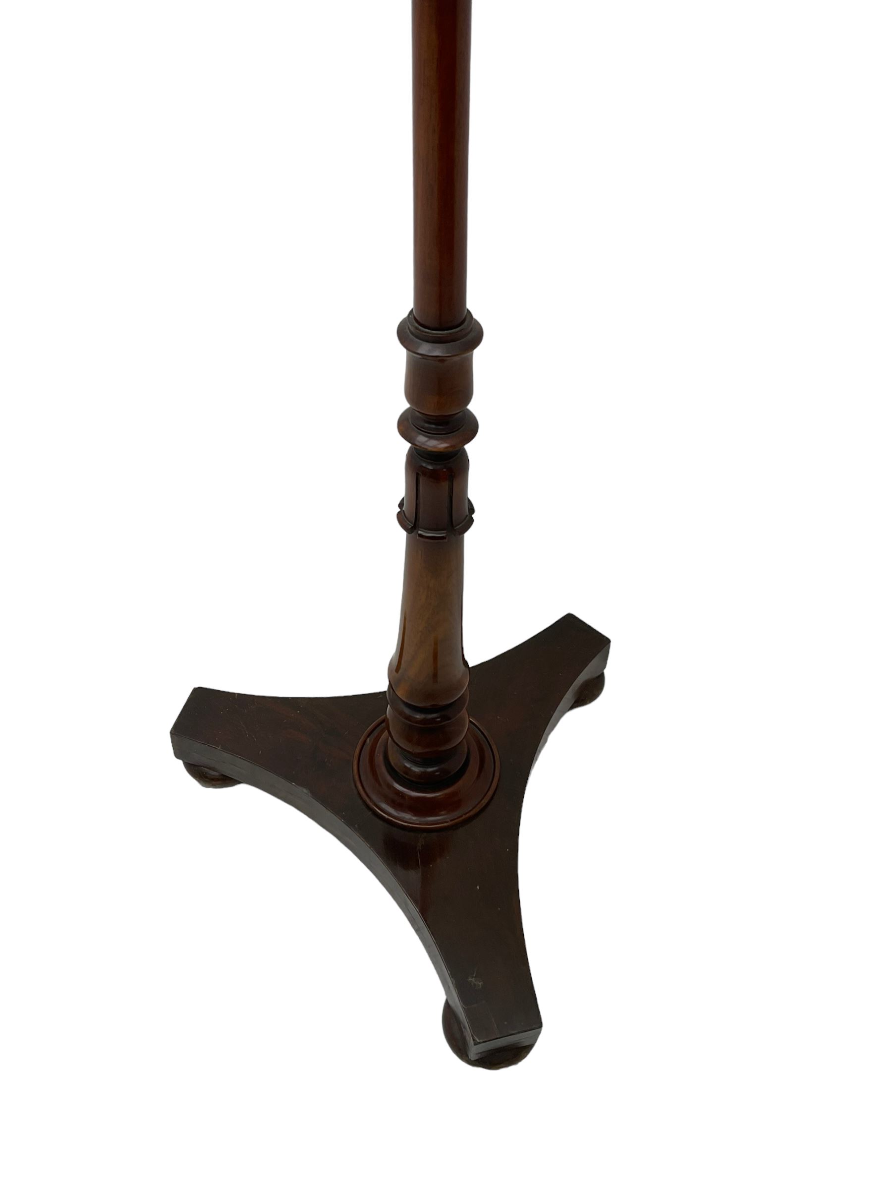 Victorian mahogany pole screen, with needlework panel depicting the Prince of Wales feathers and floral garland, vasiform pole with lappet decoration, on a concaved triangular platform with compressed bun feet