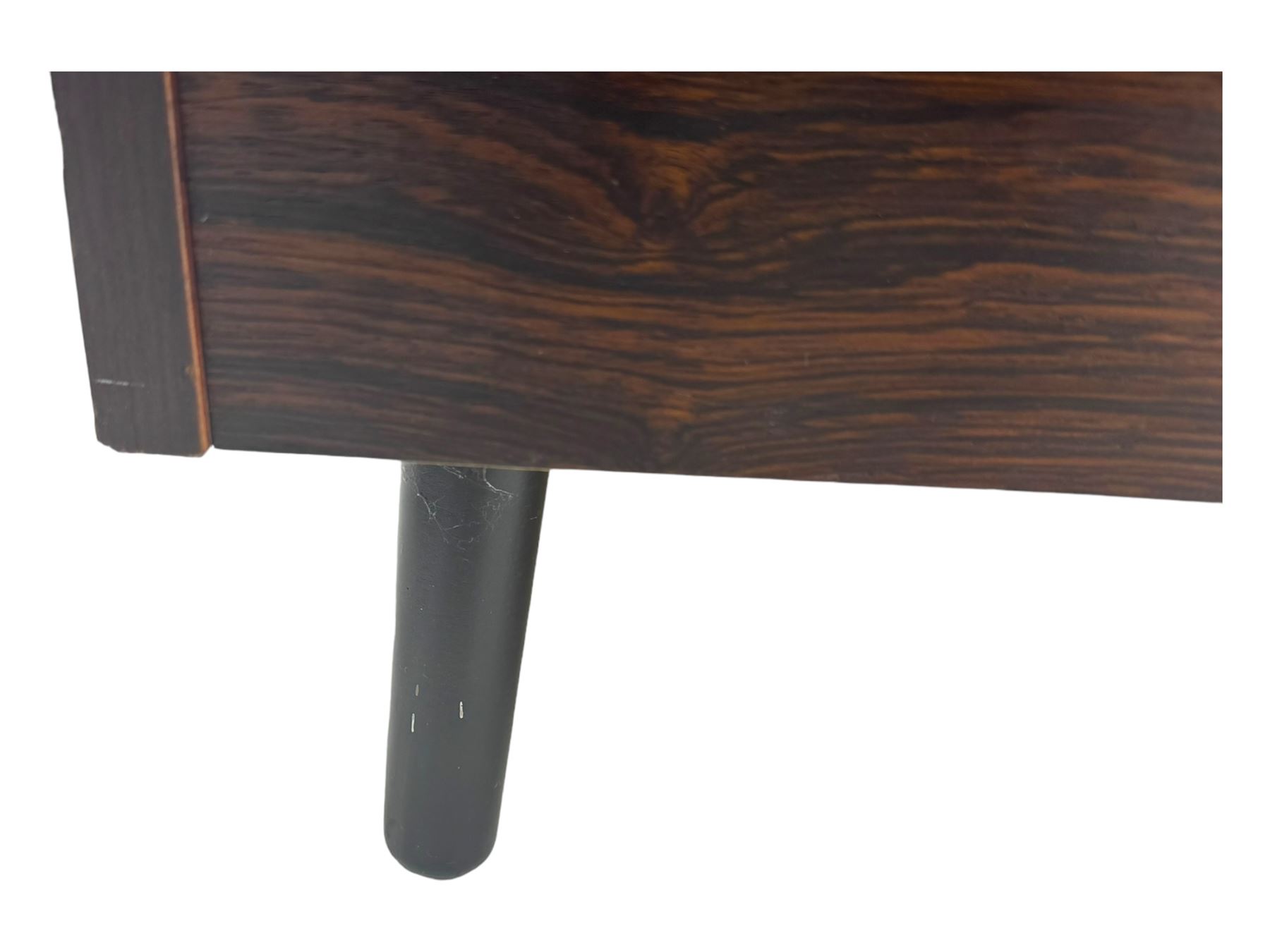 Troeds of Sweden - mid-20th century rosewood veneered cupboard, single door with brass handle enclosing interior fitted with one drawer, raised on ebonised tapered and splayed supports