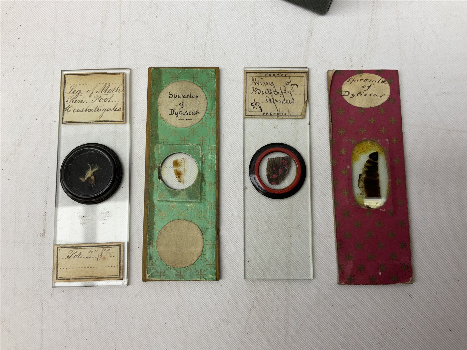  Brass field microscope, together with a cased microscope and twenty five microscope slides