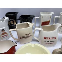 Collection of ceramic pub jugs and ashtrays, including Senior Service ashtray, Bell's old scotch whiskey ashtray,Arthur Bell & sons jug, Beefeater gin jug, two Black and White scotch whiskey jugs, etc    