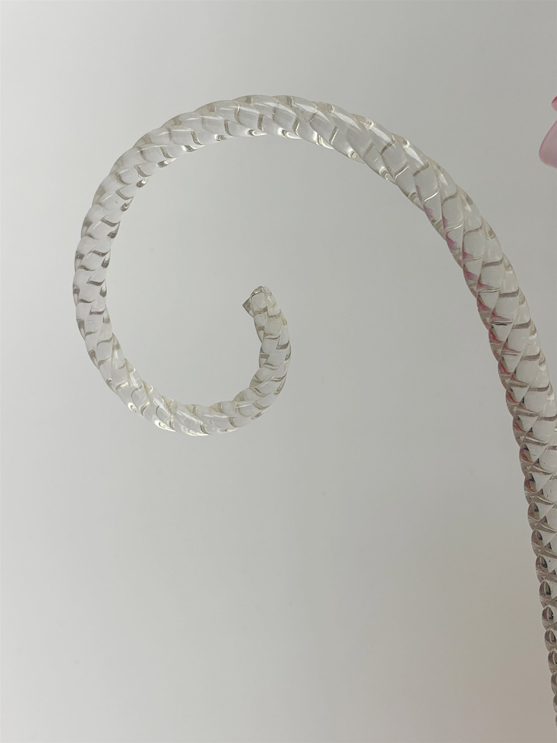 A Victorian cranberry and Vaseline glass epergne, the frilled bowl supporting two frilled trumpets and two canes, H41cm. 