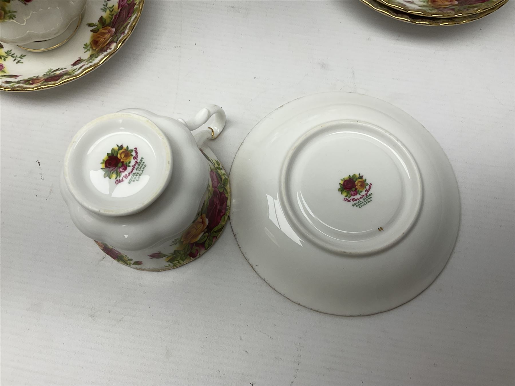 Royal Albert Old Country Roses pattern tea service for six, comprising teapot, sucrier, milk jug, dessert plates, one cake plate, one two tiered cake stand, salt and pepper pots and bud vase 