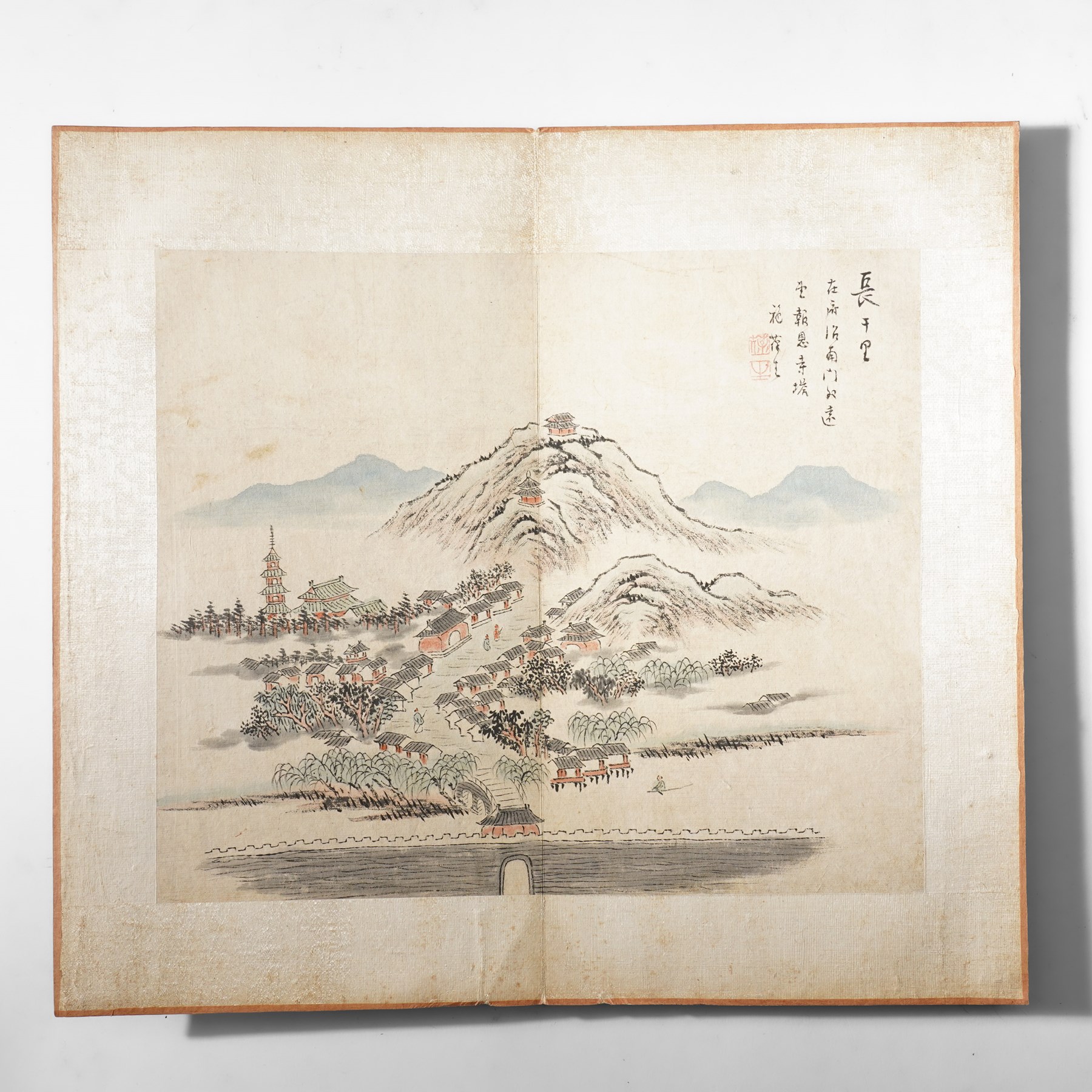 Chinese fold out book, comprising 12 hand-coloured woodblock landscapes each bearing inscription and artists seal  