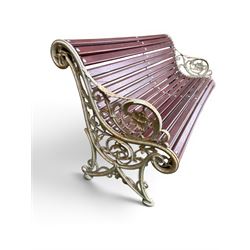 Large late Victorian cast iron garden bench, serpentine form with scroll back and seat, slatted with mahogany stained Sapele