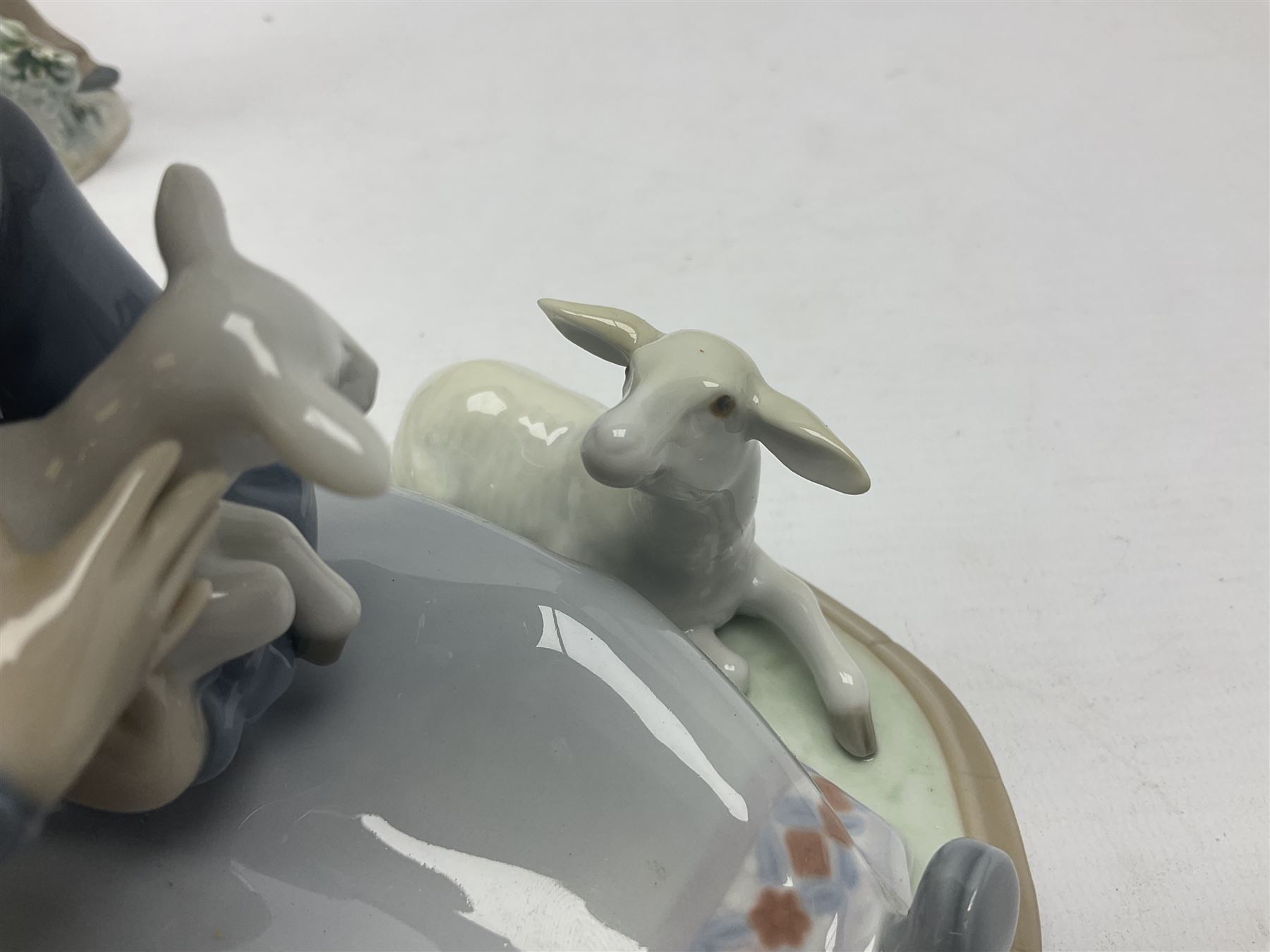 Three Lladro figures, Faithful Steed no 5769, Best Foot Forward no 5738 and Lambkins no 5469, all with original boxes, largest example H21cm 