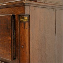 George III oak and mahogany bound enclosed bookcase-secretaire, panelled cupboards over four drawers