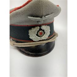 WW2 German Army Artillery officer's peaked cap, red piping to the crown and bordering the central band, zinc eagle and aluminium cockade insignia, officer's bullion chin cords, interior retains original sweatband and lining has tailor's celluloid diamond with 'Extra Klasse' logo and 'Marke Standard'