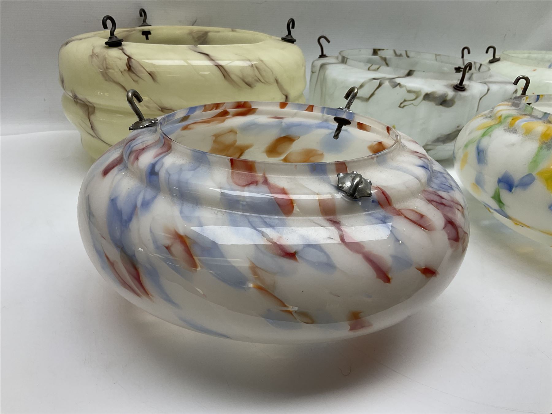 Six Art Deco glass fly catcher light shades, including marbled, mottled and frosted glass examples, largest D31cm