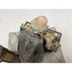 Two Capodimonte figures, comprising The Watchmaker by Curiase and Tramp Seated on a Bench, created by D.Bonalberti, tallest example H24cm