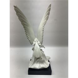 1930s Meissen figure of a seagull designed by Max Esser, modelled upon the crest of a wave with wings spread above its body, upon black square base, with blue cross swords mark, H43cm