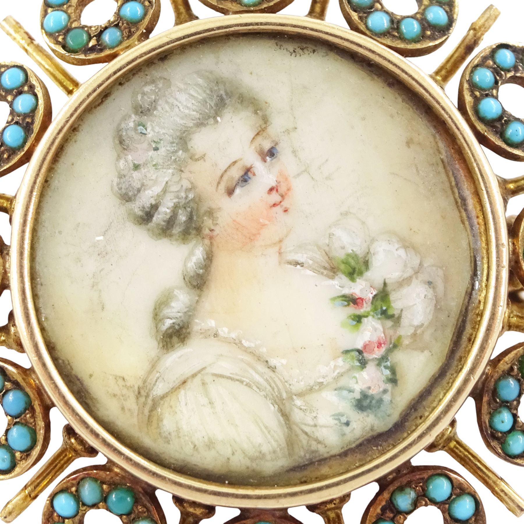 19th century gold turquoise portrait brooch / pendant, set with a circular portrait of a woman in 18th century dress on ivory, under a glazed panel, within an alternating surround of turquoise set hoops and gold spokes. This lot has been registered for sale under Section 10 of the APHA Ivory Act