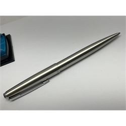 Three fountain pens, to include Conway Stewart 'Dinkie 550' and 'Conway 57' and a Parker 'Slimfold', all with 14ct gold nibs, together two roller ball pens, including a Parker example and a Swarovski Crystal paperweight