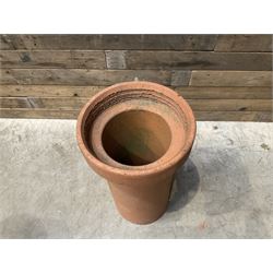Cast iron cauldron set pot with 2 terracotta chimney pots and 2 terracotta planters,