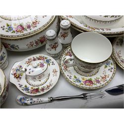 Extensive Royal Grafton Malvern pattern tea and dinner wares, comprising twelve dinner plates, six smaller plates, coffee pot, two teapots, two cake plates, eight teacups and ten saucers, six coffee cups and six saucers, two open sucriers, twin handled lidded sucrier, jug, lidded mustard pot and condiment jar, lidded tureen, two circular twin handled vegetable tureens, sauce boat and stand, oval and circular serving plates, salt and pepper shakers, breakfast cup and two saucers, further large cup and saucer, eighteen tea plates of various shapes, six side plates, six cereal bowls and six further bowls, shell dish and dish of square form, fork and knife, together with a hallmarked silver condiment spoon