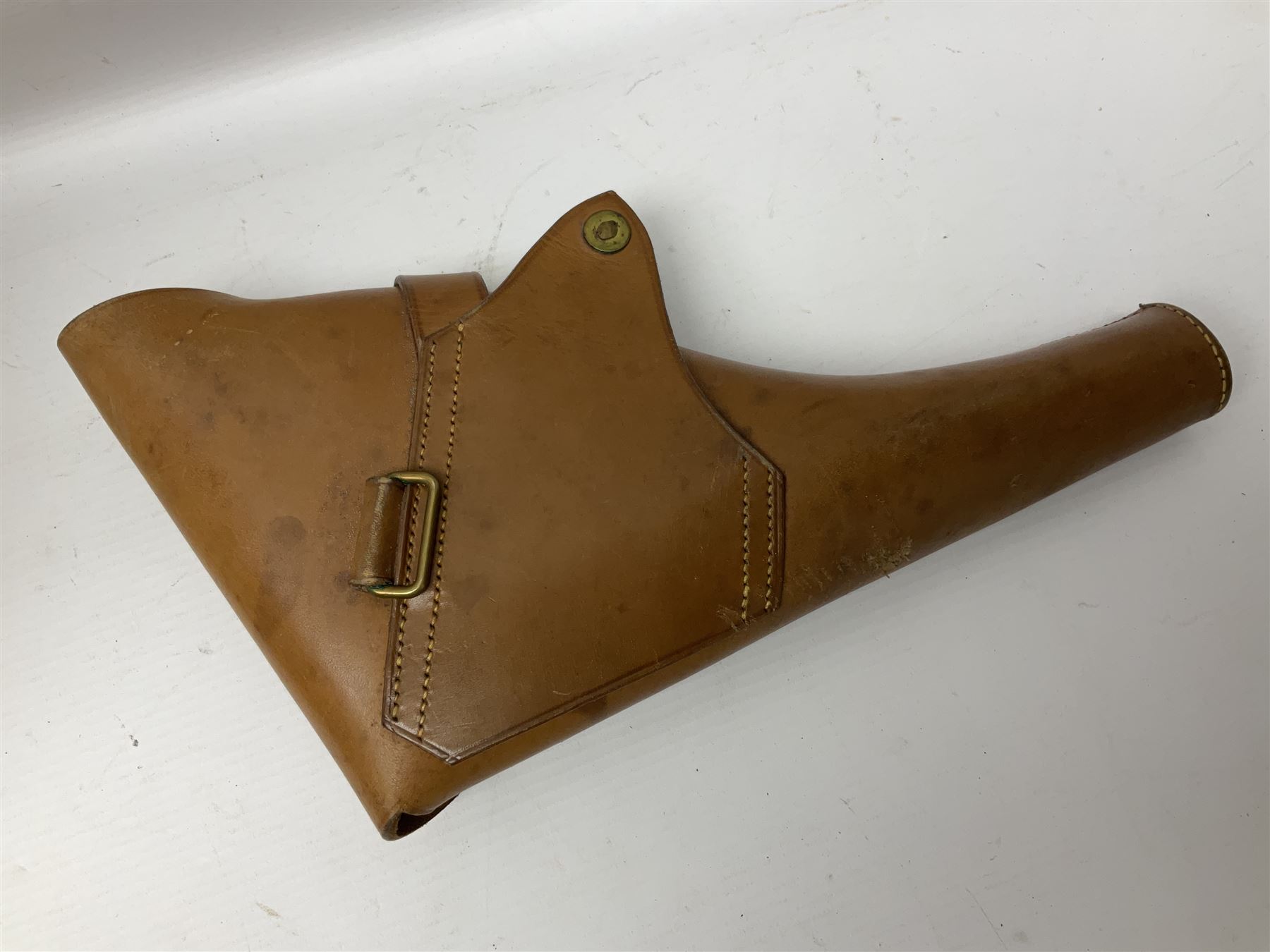 British Army General Staff officer's peaked cap by Herbert Johnson London in Moss Bros. delivery box; two officer's Sam Browne leather belts; leather pistol holster and sword hanger; pair of leather gloves and pair of spurs