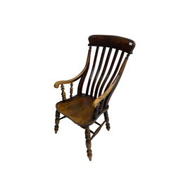 Late 19th century elm farmhouse armchair, high lath back raised on turned supports united by stretcher