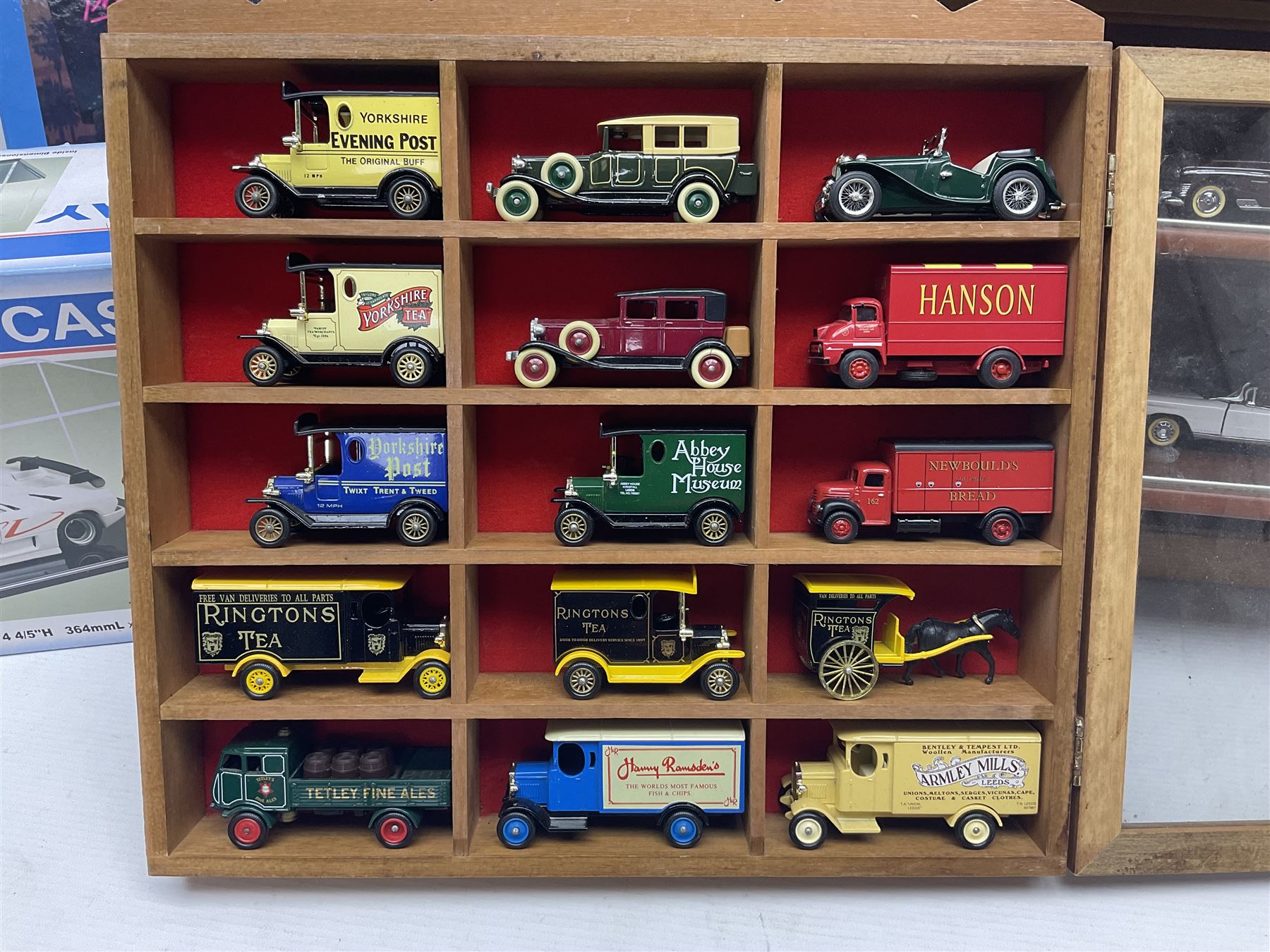 Franklin Mint 'The Classic Cars of the Fifties' collection with display rack, eleven (ex.12) die-cast models and folder of paperwork; another wall mounting display cabinet containing fifteen die-cast models; and an unused boxed Master Tools model display case