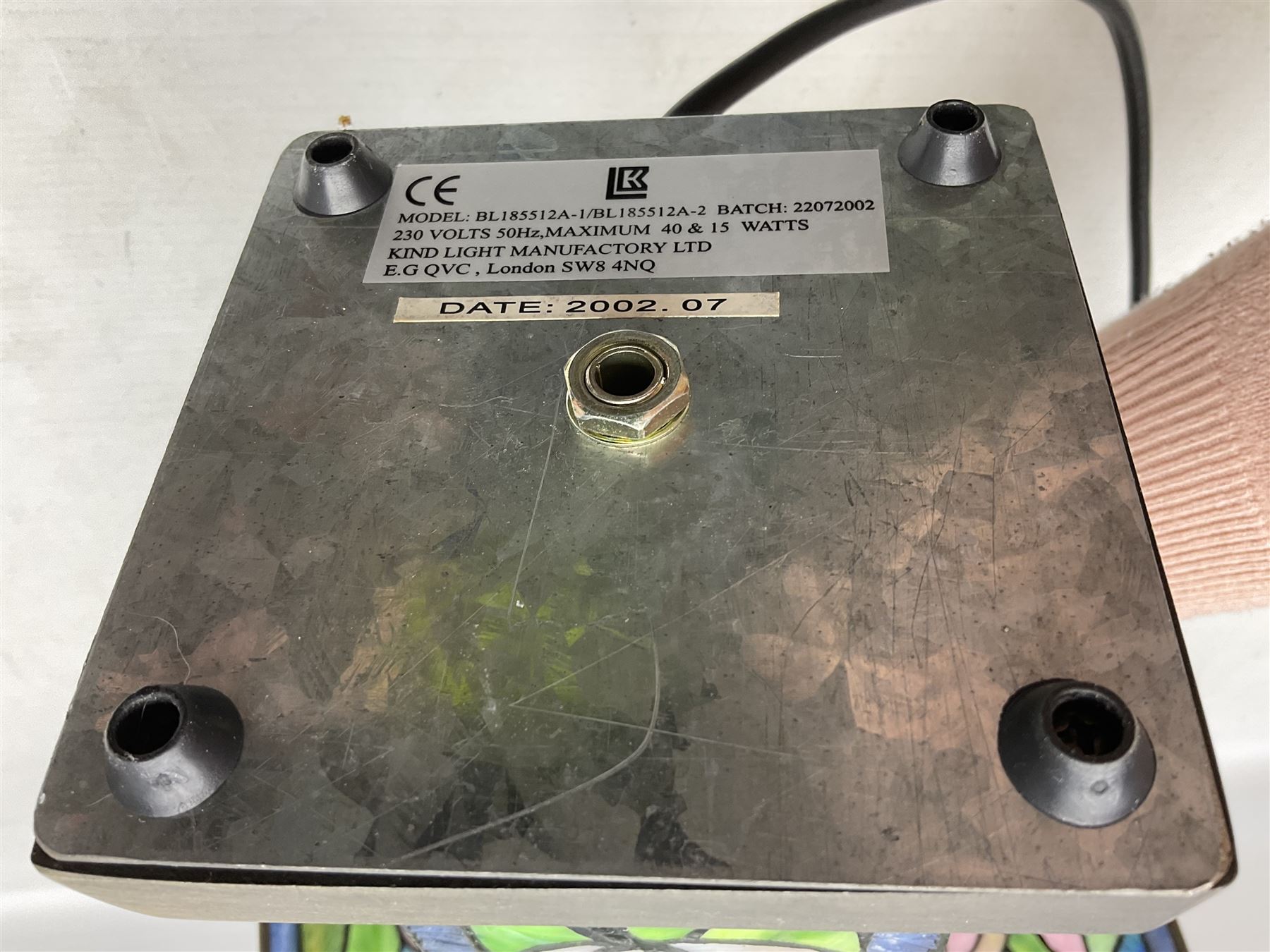 Tiffany Pond Lily style table lamp and shade with leaded panels of green, pink and rippled blue water effect ground, raised upon brushed metal base, H50cm