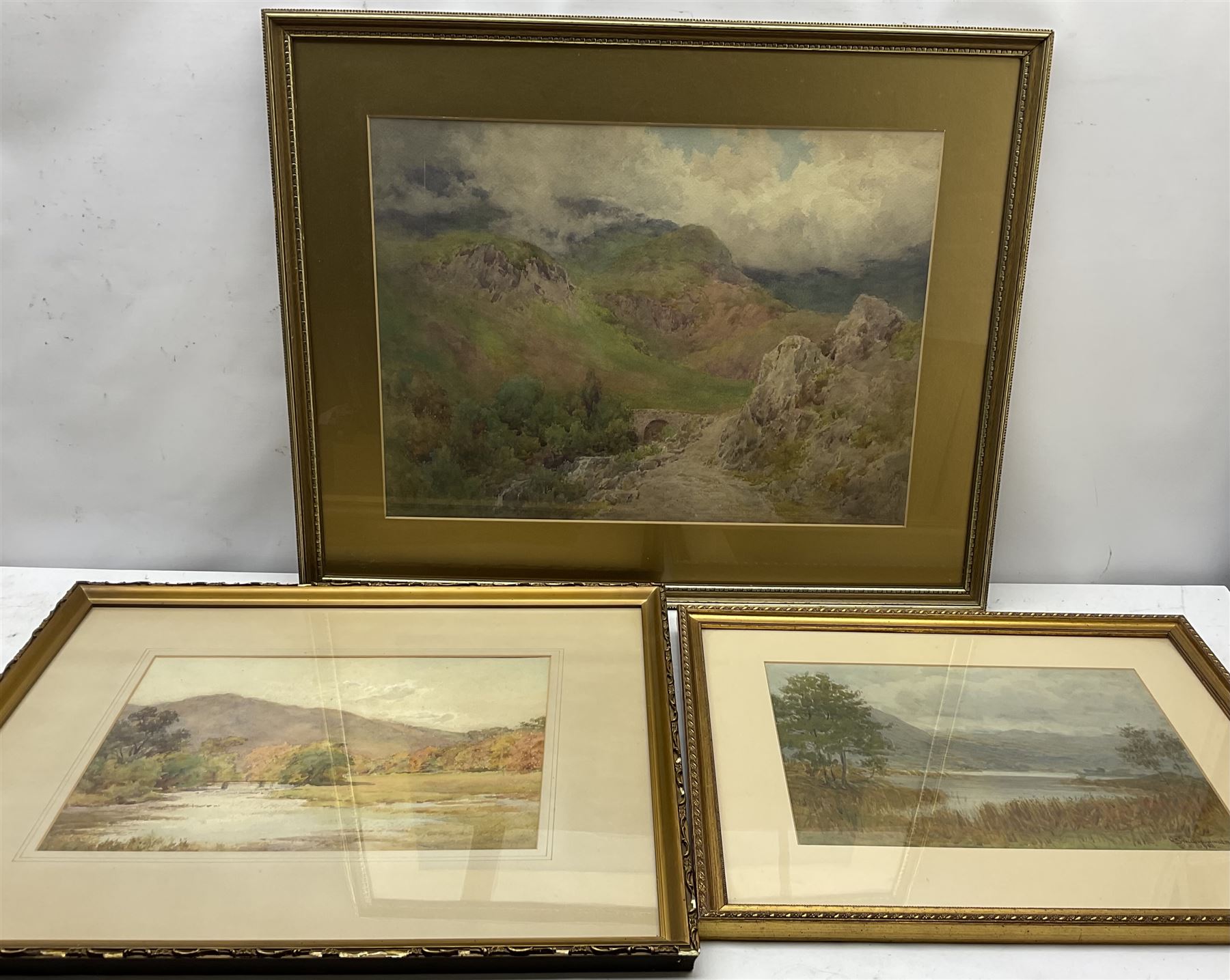 W Smallwood Winder (British 1870-1910): Lake Scene, watercolour signed and dated 1903 together with two further watercolours indistinctly signed max 39cm x 54cm (3)