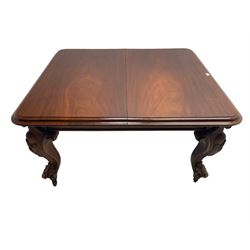 Victorian mahogany extending dining table, moulded rectangular top with rounded corners, telescopic mechanism with leaf and winding handle, on leaf and cartouche carved cabriole supports, brass and ceramic castors