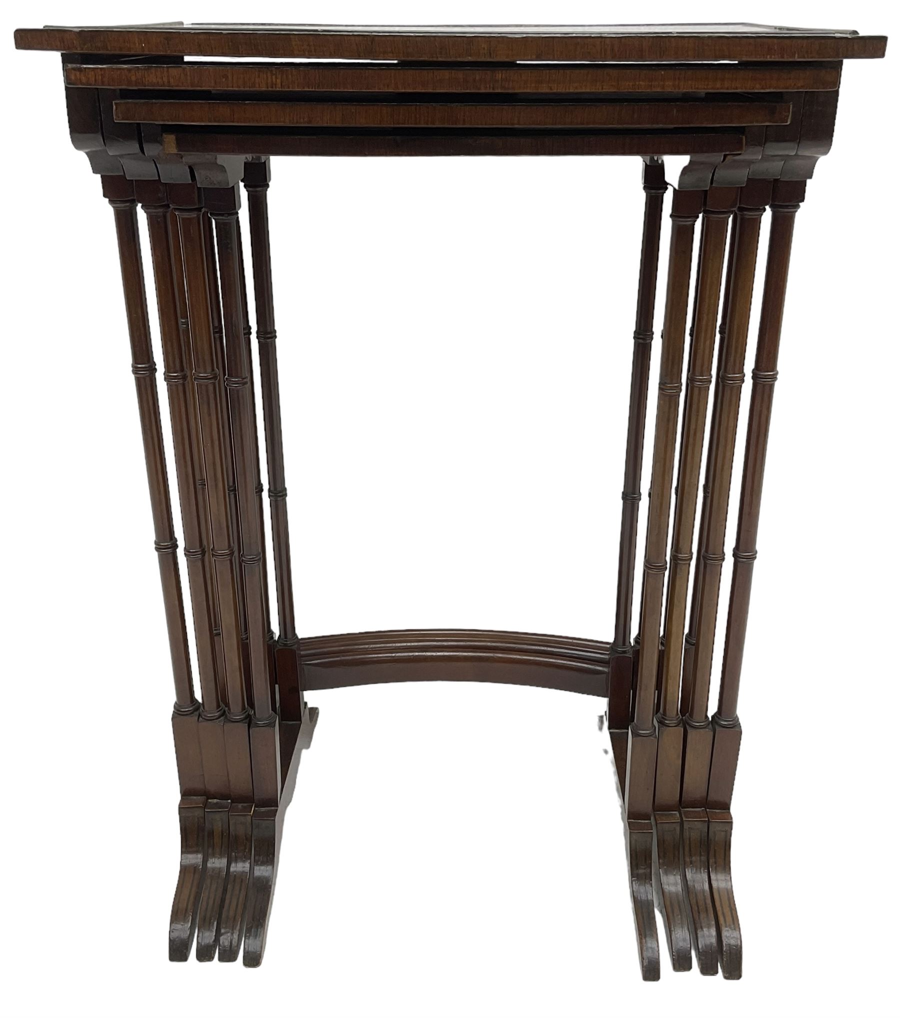 20th century inlaid mahogany quartetto nest of four tables, rectangular top inlaid with birdseye maple oval panel, ring turned supports on sledge feet