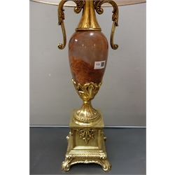  Large gilt metal table lamp, 19th century style, of urn form with simulated polished stone body, scrolled arms on square base with four scroll feet, H57cm of main body  