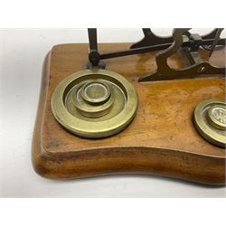 Set of brass postal scales, on wooden base