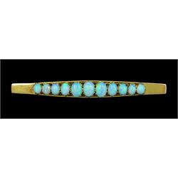 Early 20th century gold graduating eleven stone opal brooch, stamped 9ct