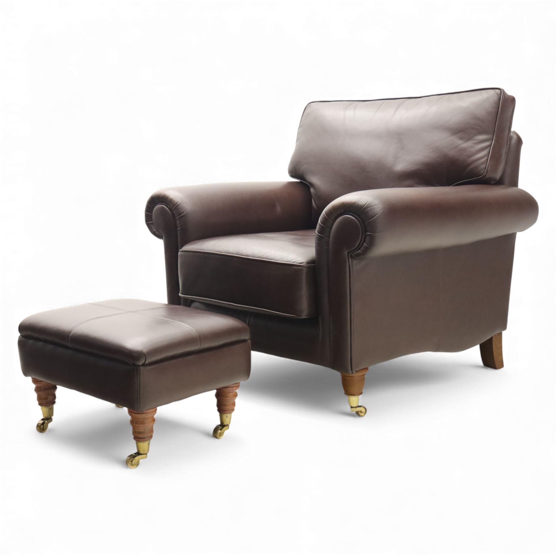 Laura Ashley - brown leather armchair and foot stool, loose cushion back and seat, flanked by scrolled arms upon light stained wood supports on castors, matching brown leather footstool with four panel top over light stained supports on castors (Footstool H 31cm, W 52cm)