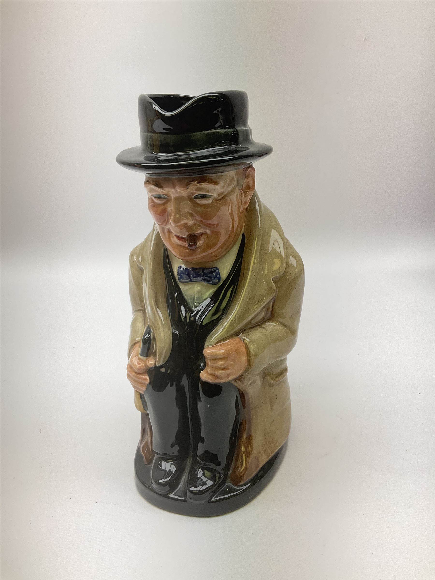 Royal Doulton toby jug of Winston Churchill H23cm and large character jug of Falstaff; together with four collector's plates by Royal Crown Derby, Royal Worcester and Limoges (6)