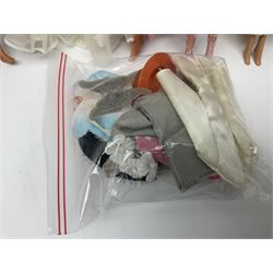 Eleven 1980s fashion dolls, predominantly Barbie/Ken, all dressed; together with some additional clothing.