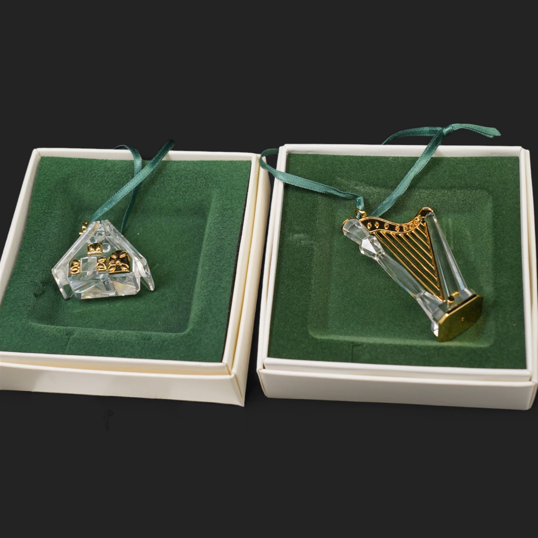 Twelve Swarovski crystal 'Christmas' and 'Crystal' Memories ornaments, comprising Moon, Sun, Boot, Candy Cane, Christmas Wreath, Pinecone and Holly etc, boxed and with sleeves (12)