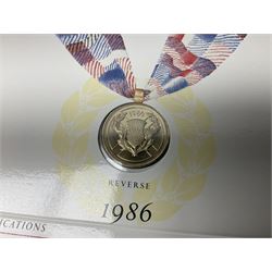 Two Great Britain and Northern Island proof sets dated 1970 and 1971, both with card cases, three 1986 Commonwealth Games commemorative two pound coins, in card folders, and six brilliant uncirculated one pound coins, in card folders