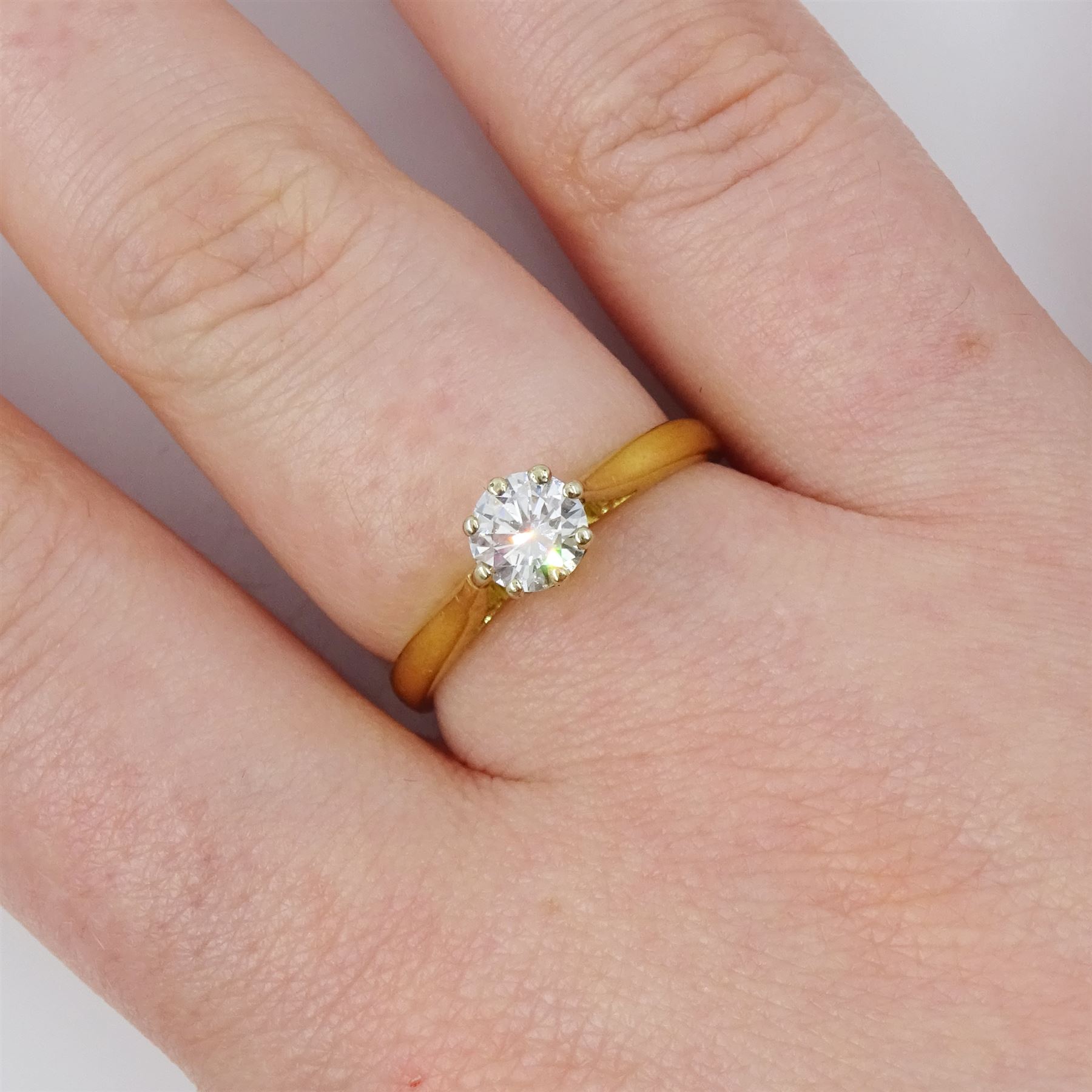 18ct gold diamond ring, eight claw set with a single round brilliant cut diamond of 0.49 carat, London 1973