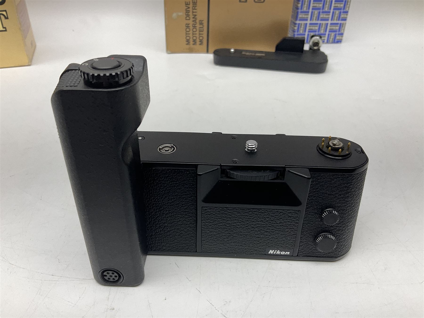 Nikon F3T camera body, in champagne/ titanium colourway, serial no. T8215031, with 'Nikon Nikkor 50mm 1:1.4' lens, Nikon MD4 motor drive, serial no. 156592 and Nikon MK-1 Firing range converter, all with original boxes 