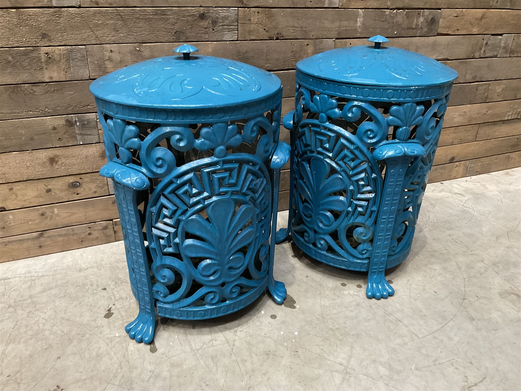 Pair of blue painted cast iron garden bins
