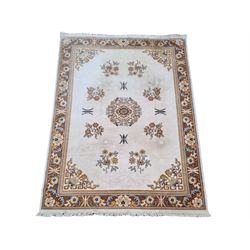 Large Persian design beige ground rug