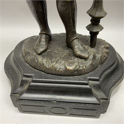 Pair of bronzed figure modelled as a hunter in traditional dress, each holding a pike, H48cm