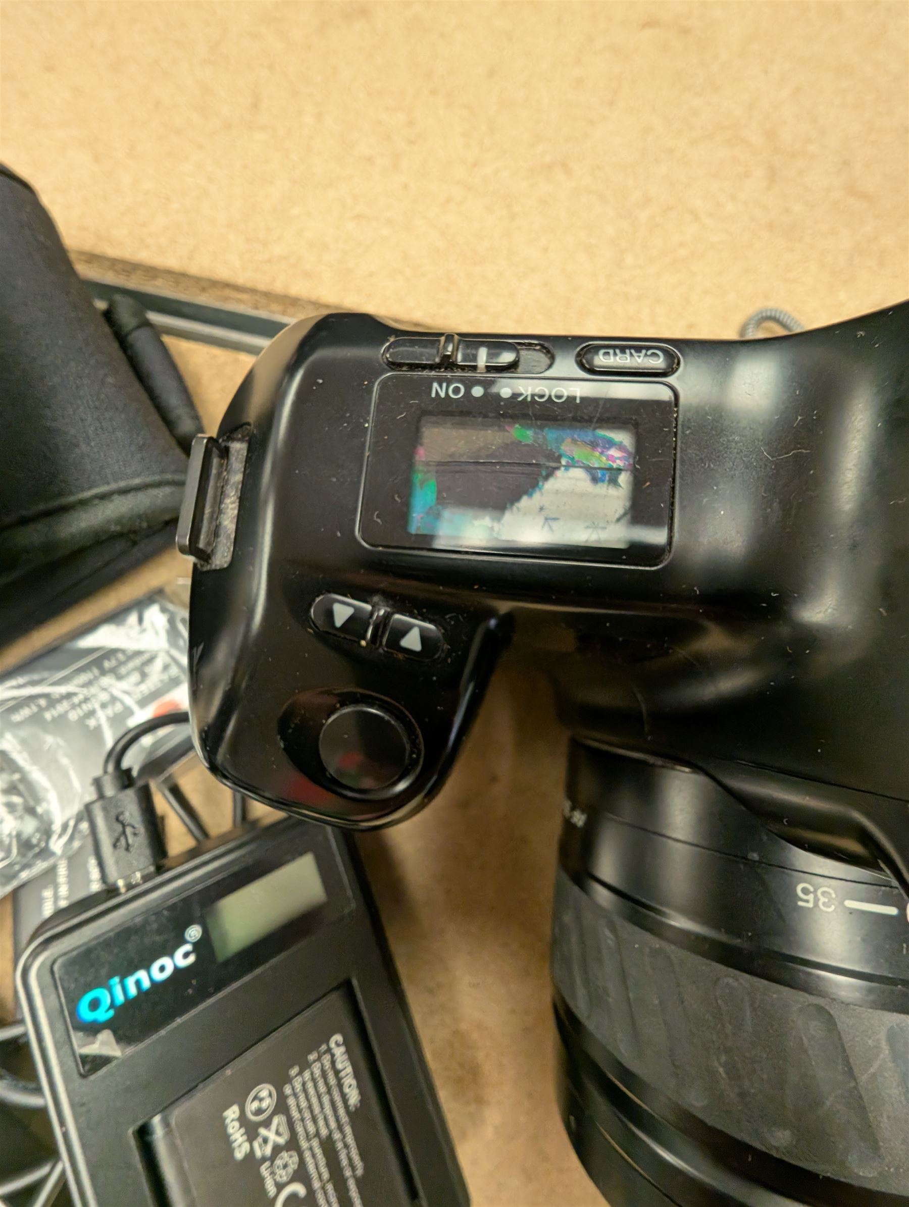 Panasonic Lumix DMC-LF1 digital camera, with charger and instruction booklet, together with a Minolta Dynax 5000i SLR camera body with a Minolta AF Zoom 35-80mm 1:4 (22)-5.6 lens, and a Fujifilm Finepix T digital camera