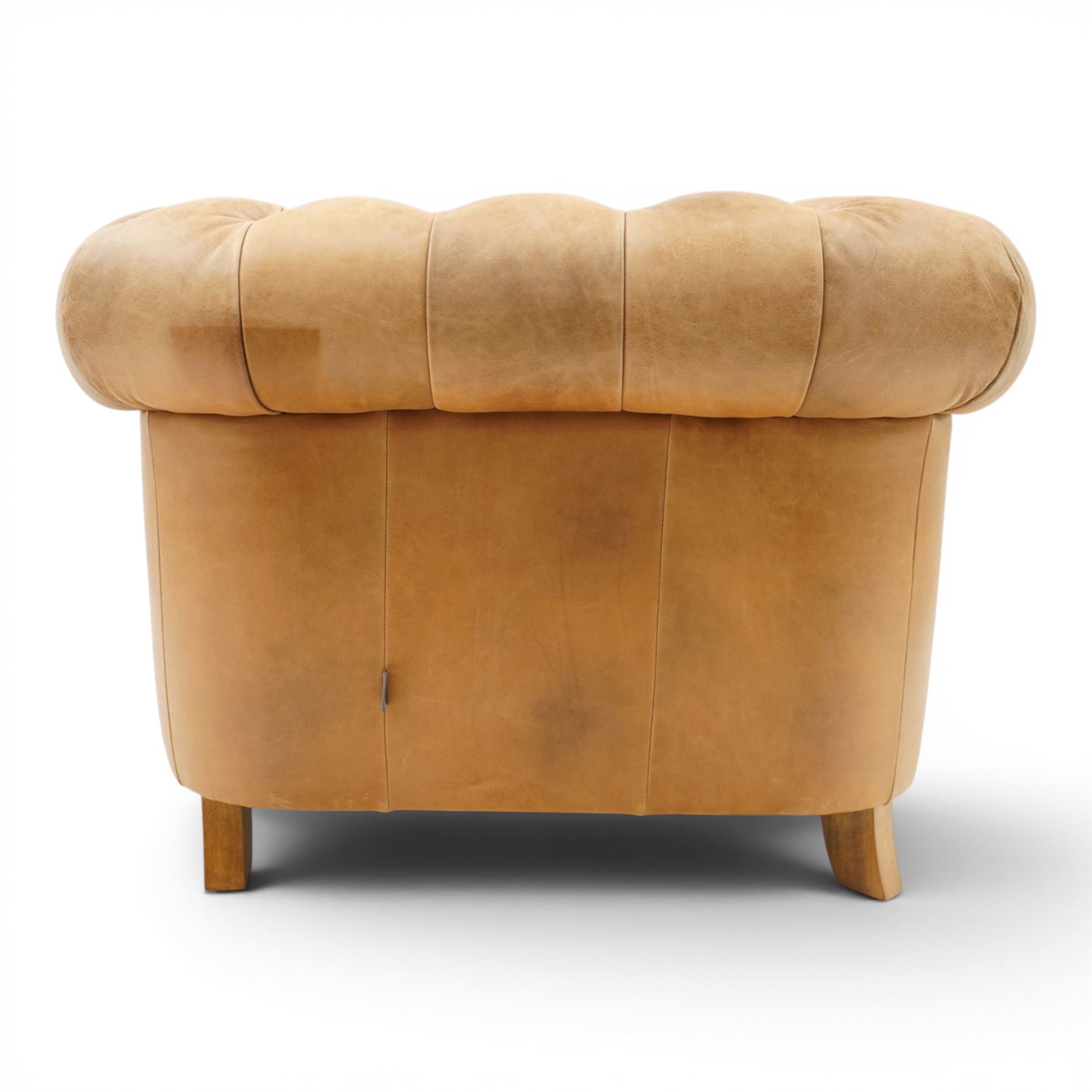 Alexander James - Chesterfield tan armchair, button backed with scrolled arms, brass studded trim raised on light wood turned feet