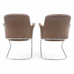 Four Senator executive cantilever chairs, upholstered in Padova hide, moulded back and integrated armrests, raised on a tubular chromed cantilever base