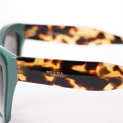 Prada - pair of cat-eye sunglasses, with green acetate frames and graduated tinted lenses, the arms in tortoiseshell finish with gold-tone ‘Prada’ branding, unused with original hard case and box