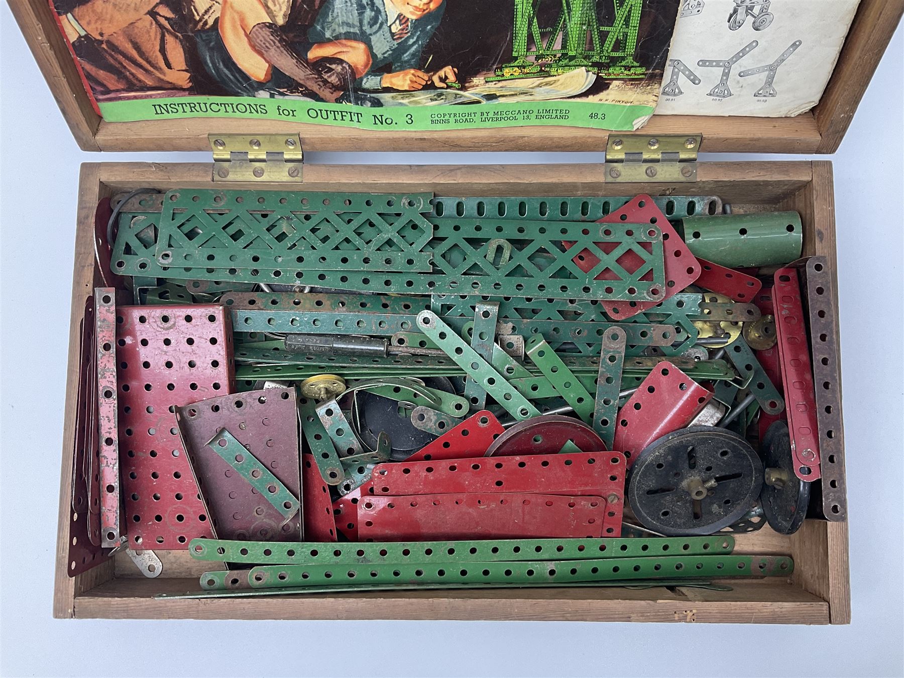 Meccano - quantity of playworn sections in red and green, in scratch-built pitch pine box with 3, 3A and 4A instruction booklets, box L43cm