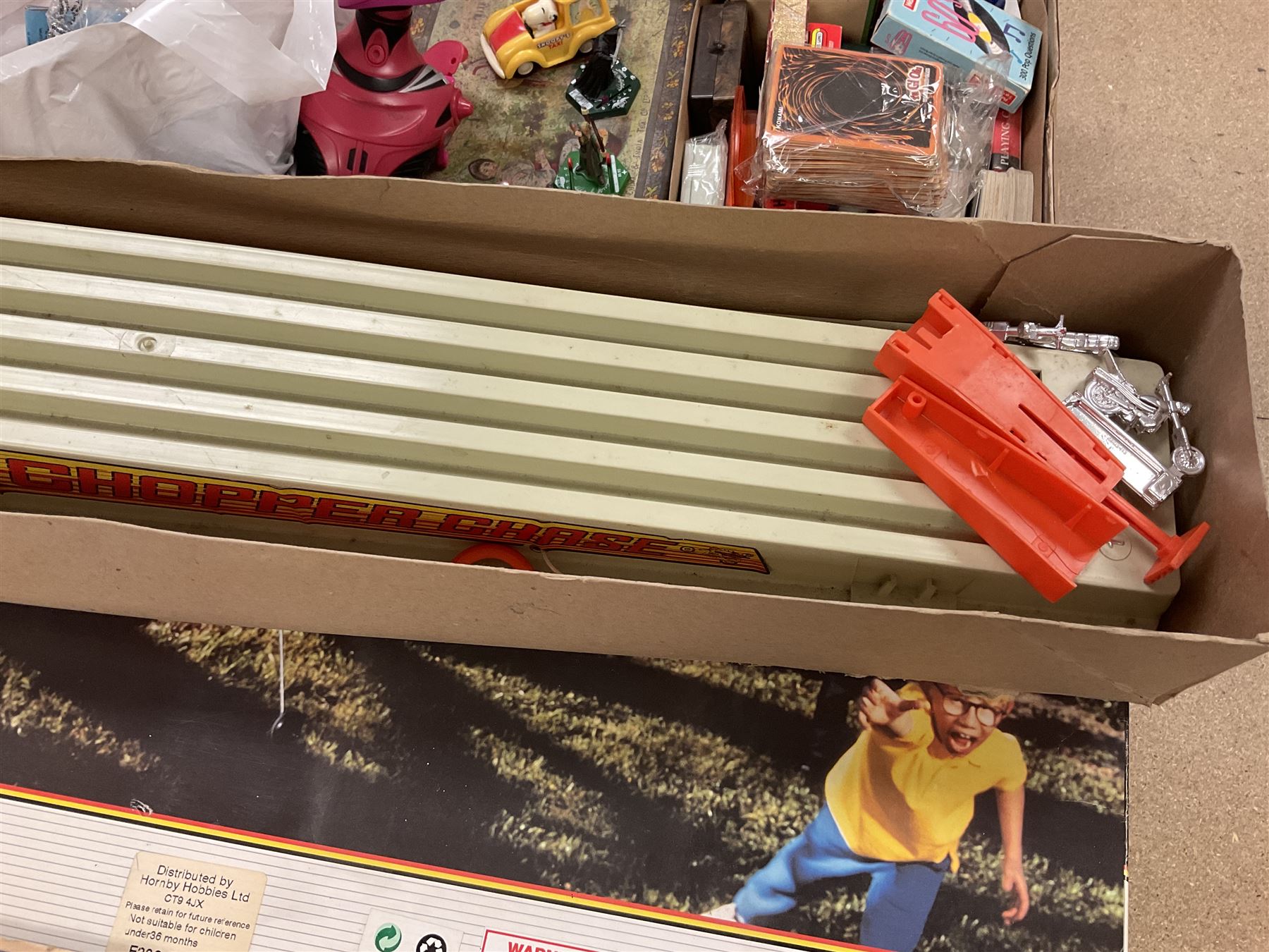 Large quantity of modern toys to include Matchbox Chopper Chase, Nikko battery control airplane, small amounts of K’nex, Meccano, playing cards to include Yu-Gi-Oh cards, keyrings etc in three boxes 