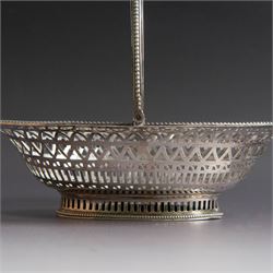 George III silver bon bon basket, of oval form with bead rim and swing handle, the sides with pierced latticework decoration, hallmarked Hester Bateman, London 1785, handle H14cm