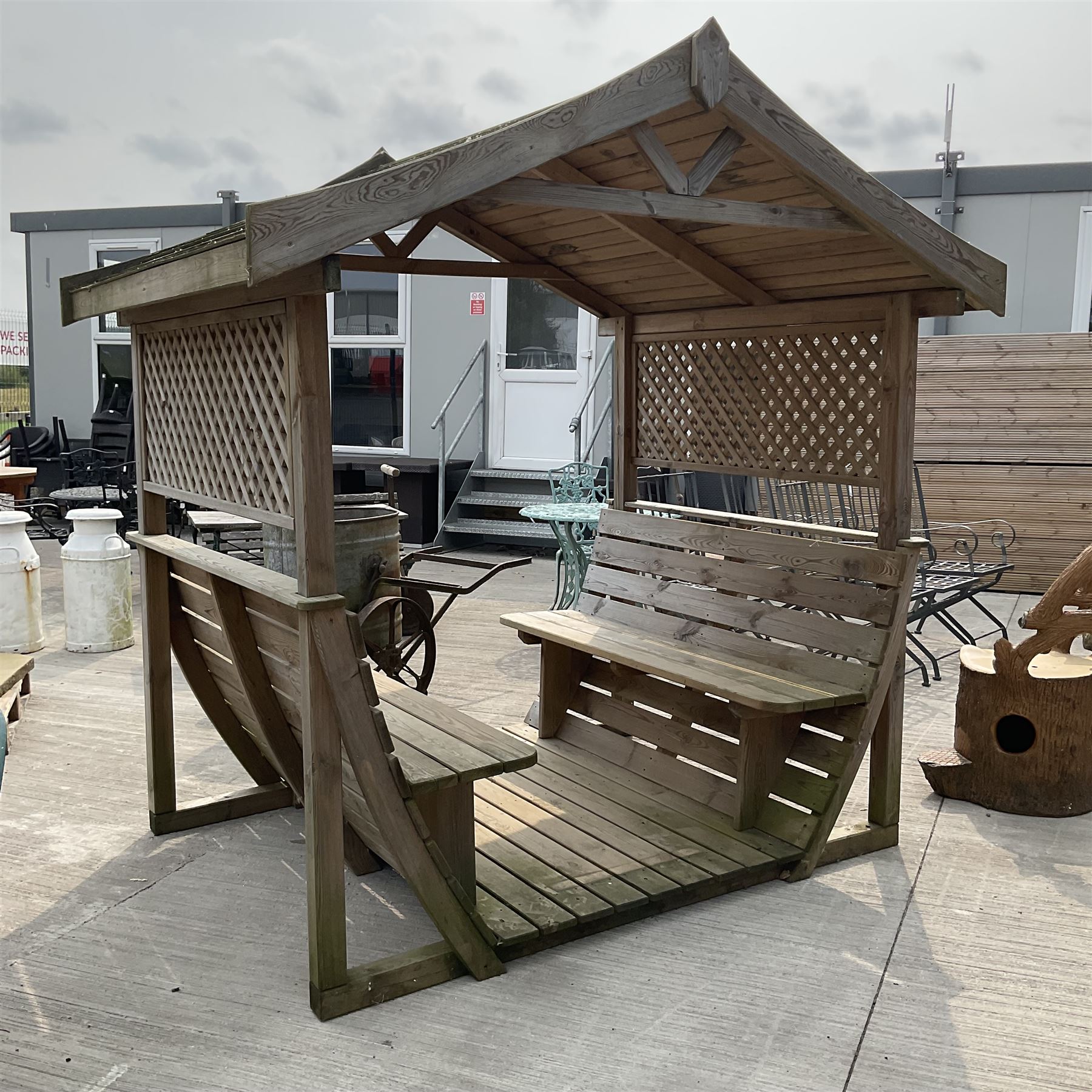Large wood slatted garden seat with canopy, lattice sides
