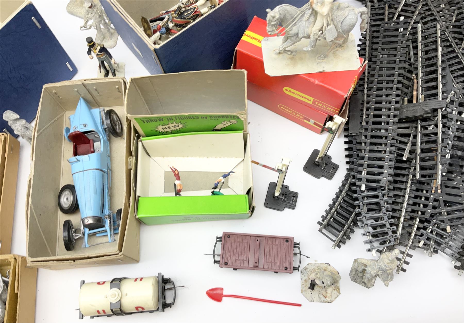 Fifty modern lead figures of mounted and foot soldiers, various period uniforms from 18th century to WW2, painted and unfinished with related paperwork; small quantity of Hornby '00' gauge model railway items and track; and four boxed Subbuteo teams etc